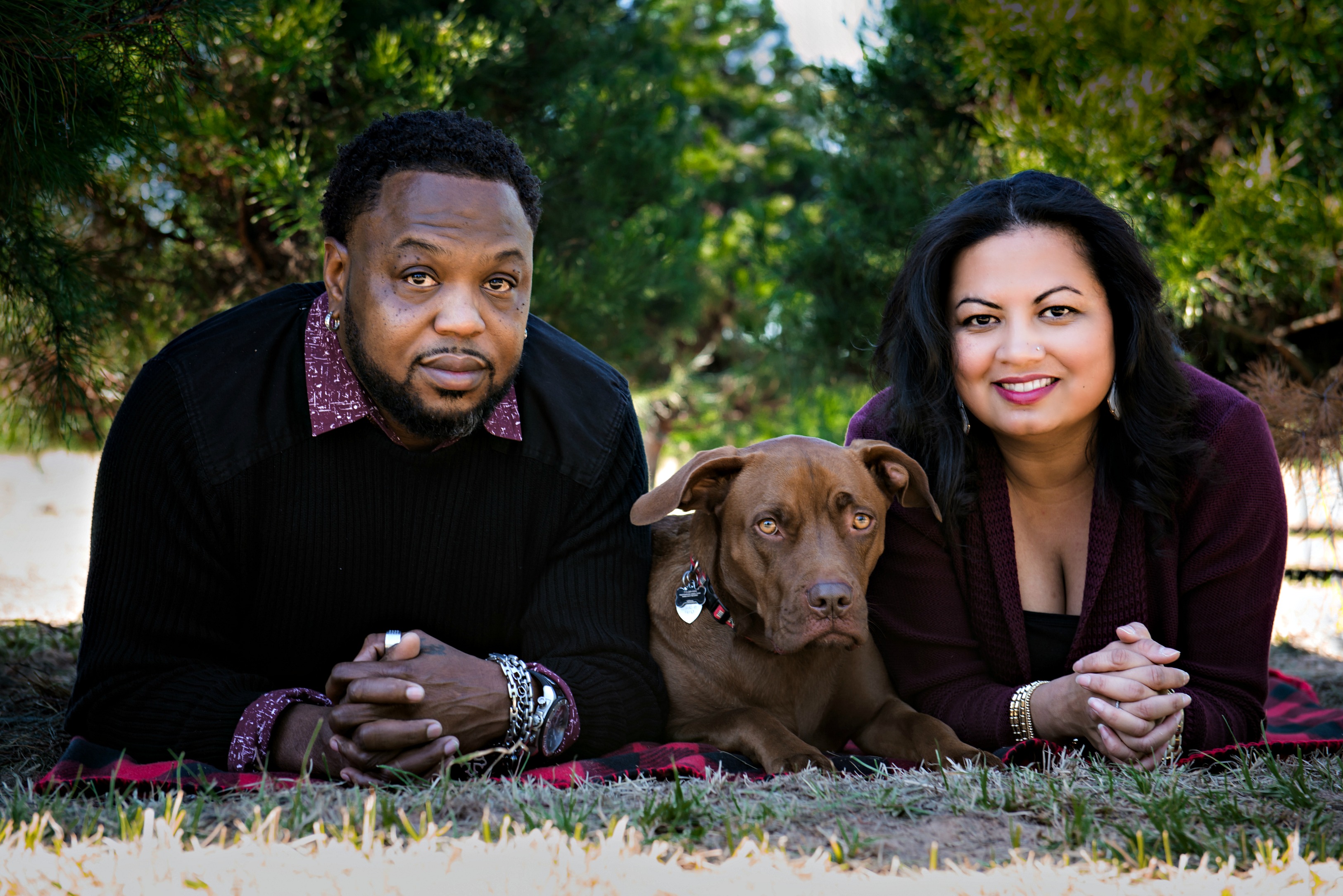 couple with brown dog