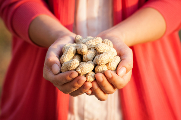 hands with peanuts