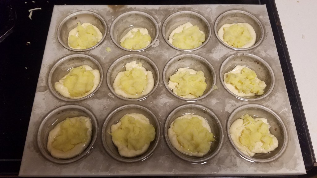 Dough with mashed sweet potato, ready to add cheese and toppings