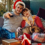 holiday couple and dog watching TV