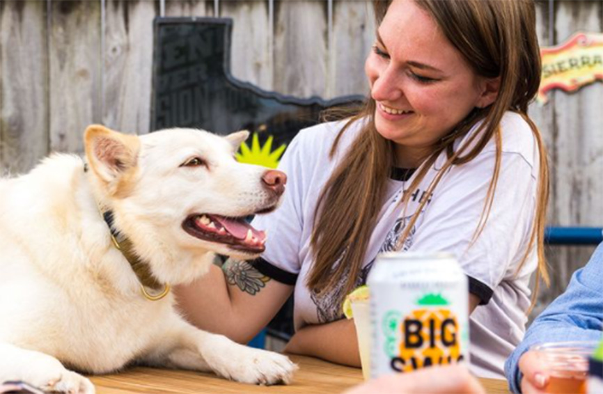 woman and dog smiling