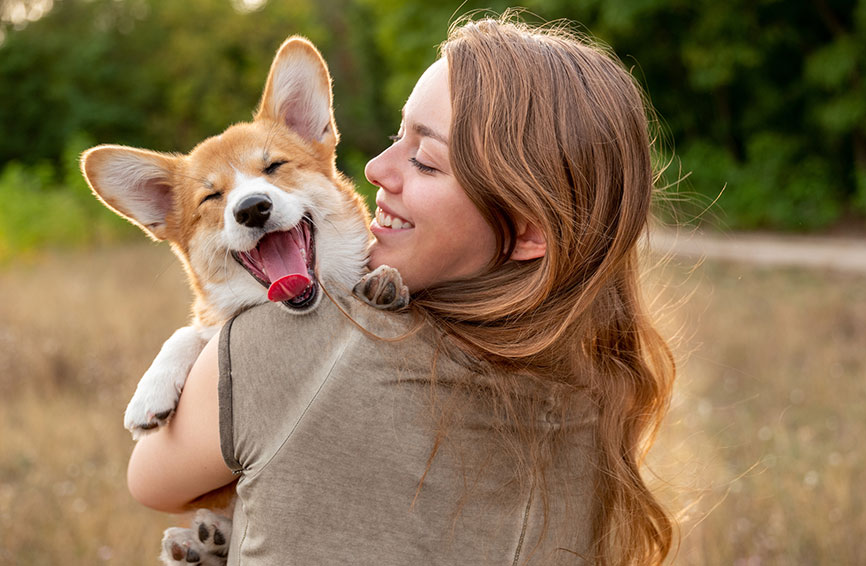 Woman and corgi