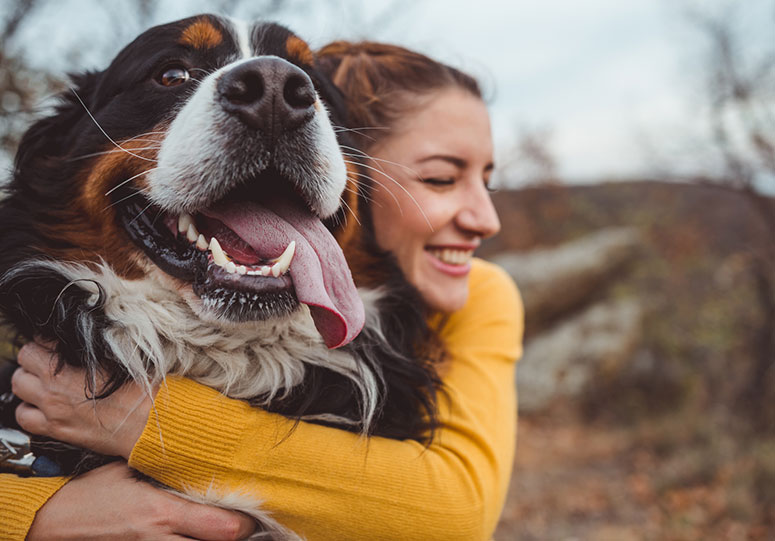 Woman hugging dog